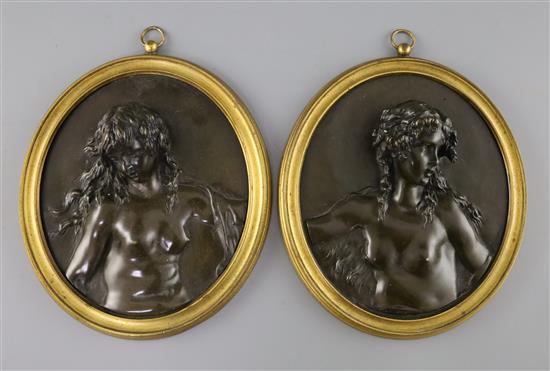 A pair of 19th century French bronze oval relief plaques of Bacchanalian women, overall W.6.75in. H.8.25in.